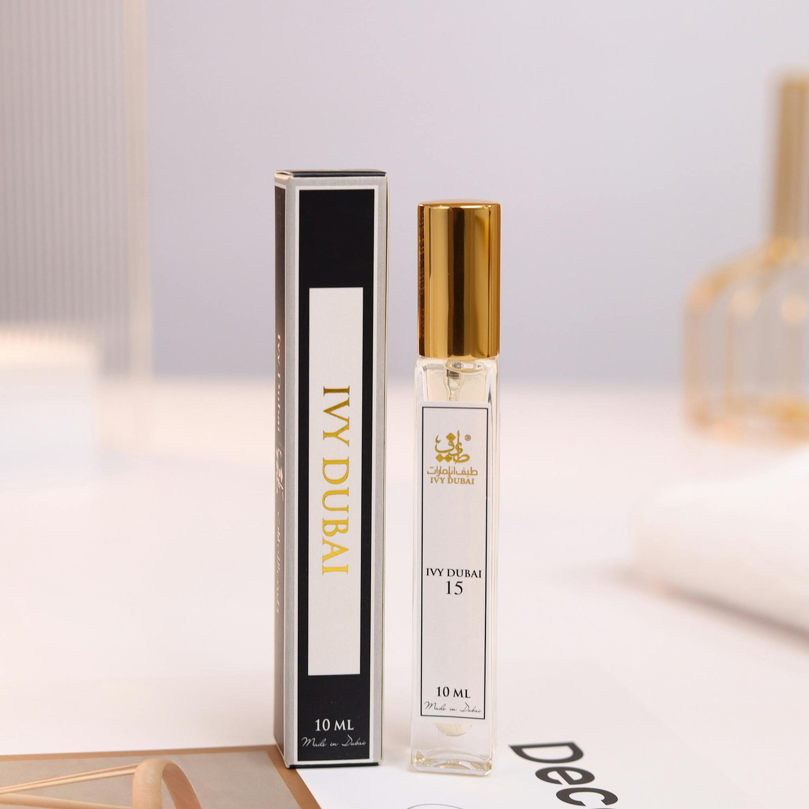 Elegant still life of IVY DUBAI perfume and box showcasing luxury packaging with gold accents.